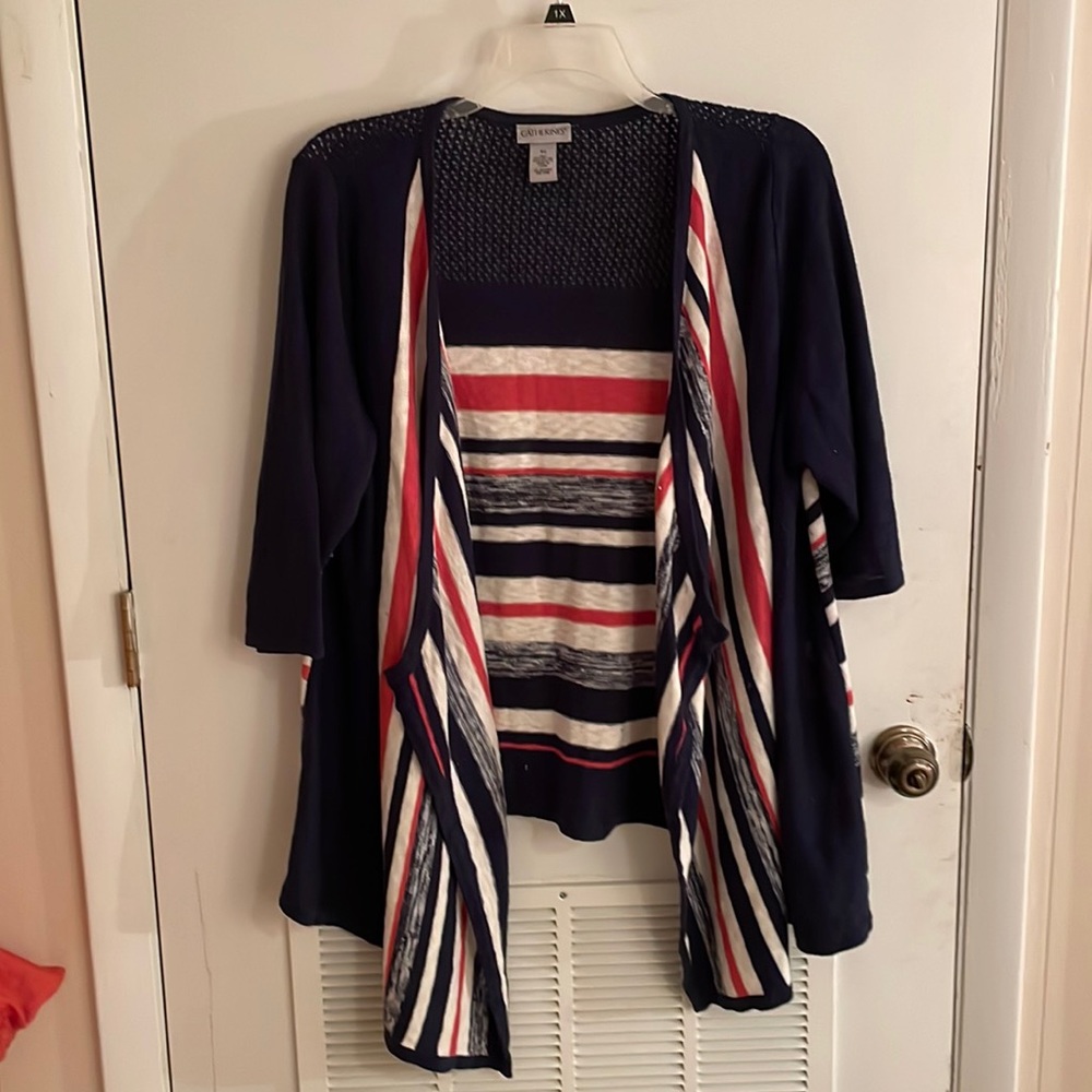 Sweater. 3/4 length sleeve. Longer in front with angle point.